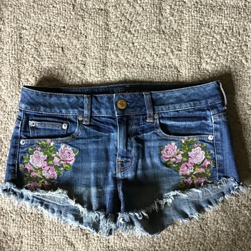 Woman’s denim cut off shorts, with flower embroidery, size 2. American Eagle .